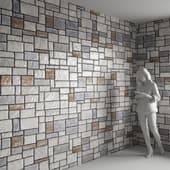 a wall of multicolored stone