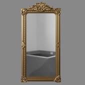 a full-length mirror in a gold carved frame.